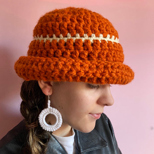 Handmade burnt orange chunky crochet bowler hat with cream stripe