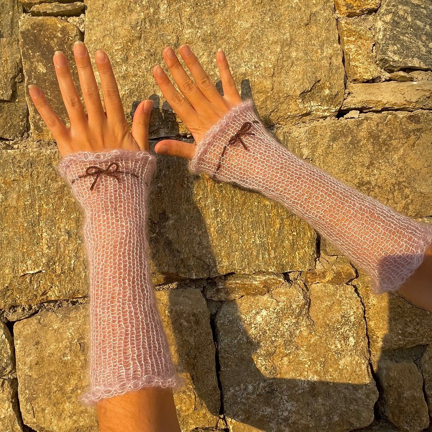 Handmade knitted mohair hand warmers in lilac with brown bow