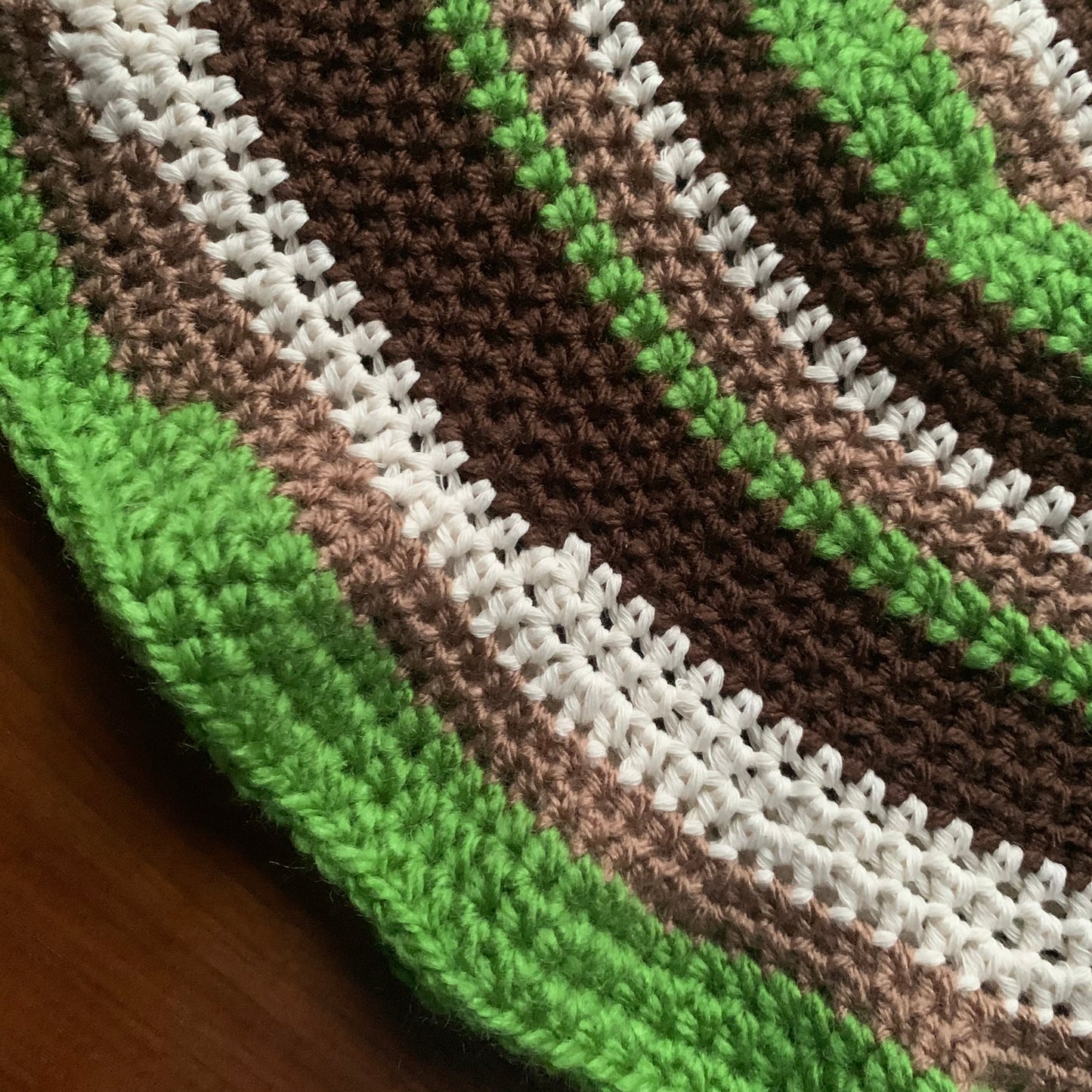 Handmade striped crochet bucket hat in green, brown and off white