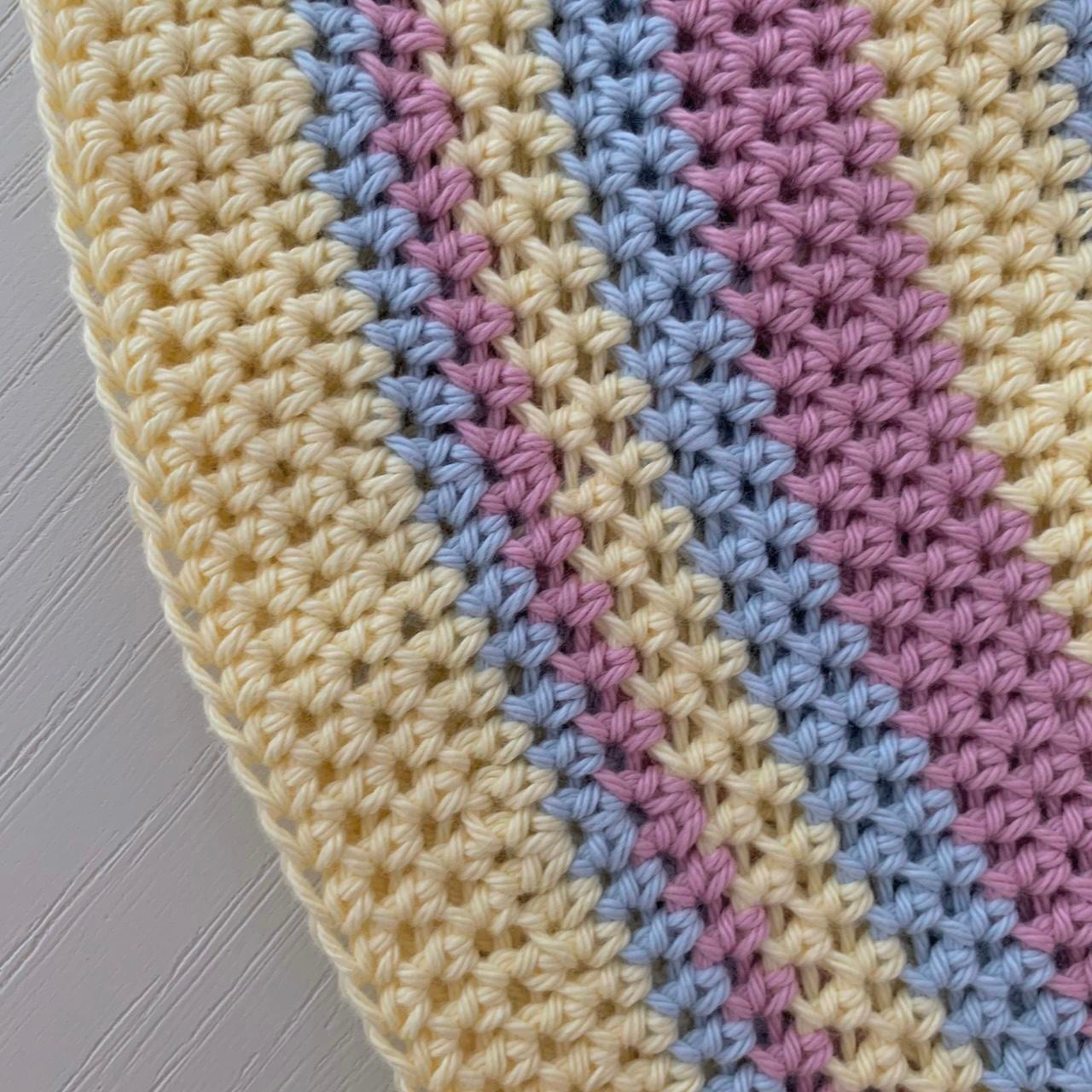 Handmade cotton crochet bucket hat in striped pastel shades