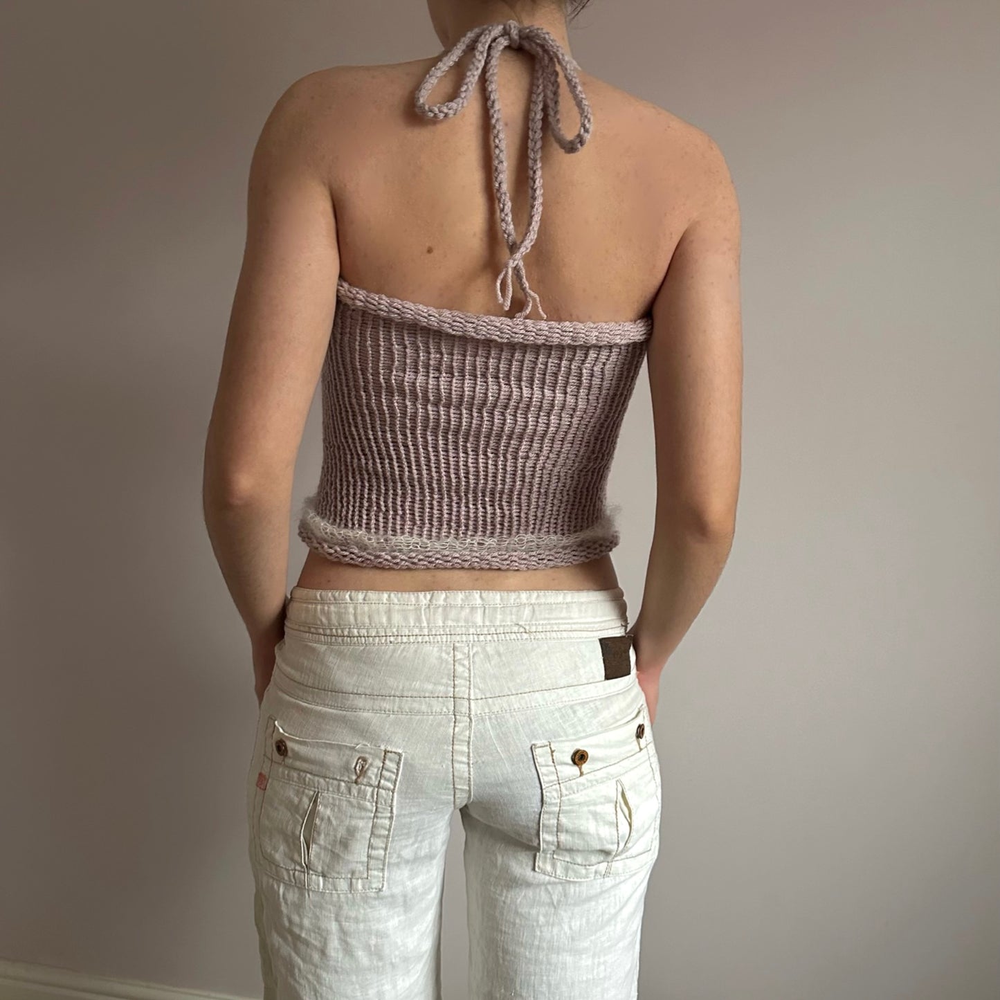 Handmade knitted mohair bow top in dusky pink and cream