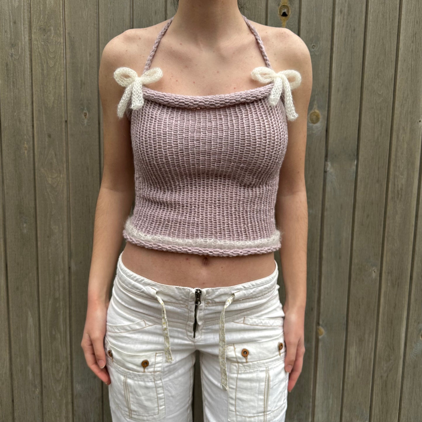 Handmade knitted mohair bow top in dusky pink and cream