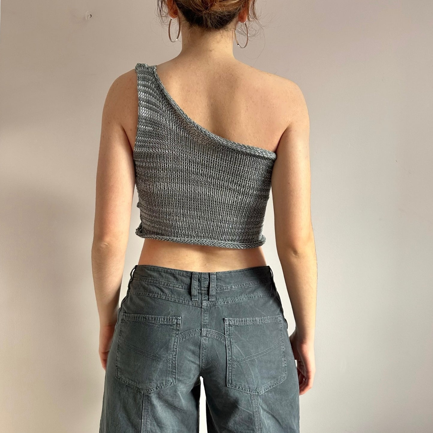 Handmade knitted metallic asymmetrical one shoulder top in silver and grey