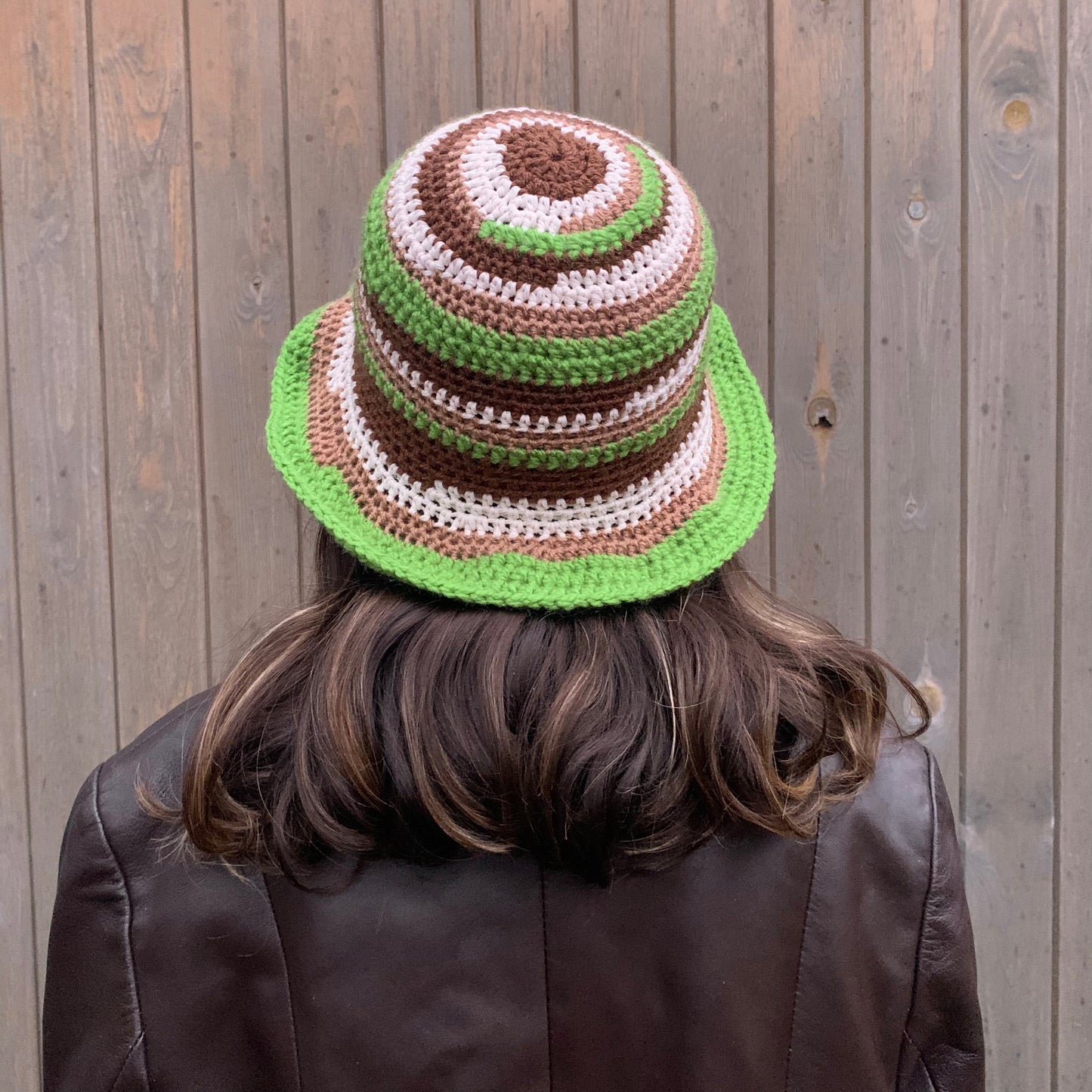 Handmade striped crochet bucket hat in green, brown and off white