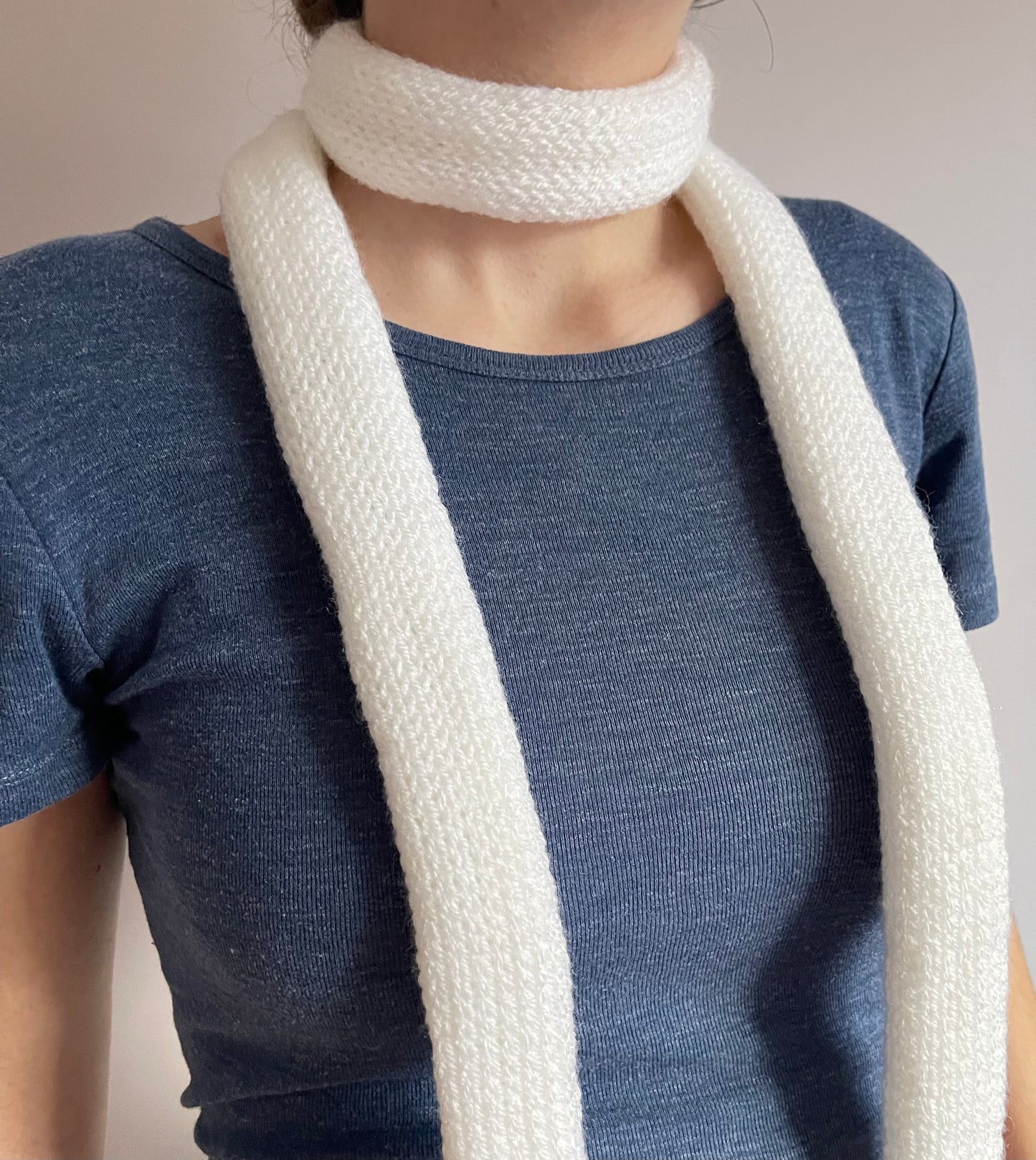 Handmade knitted skinny scarf in white