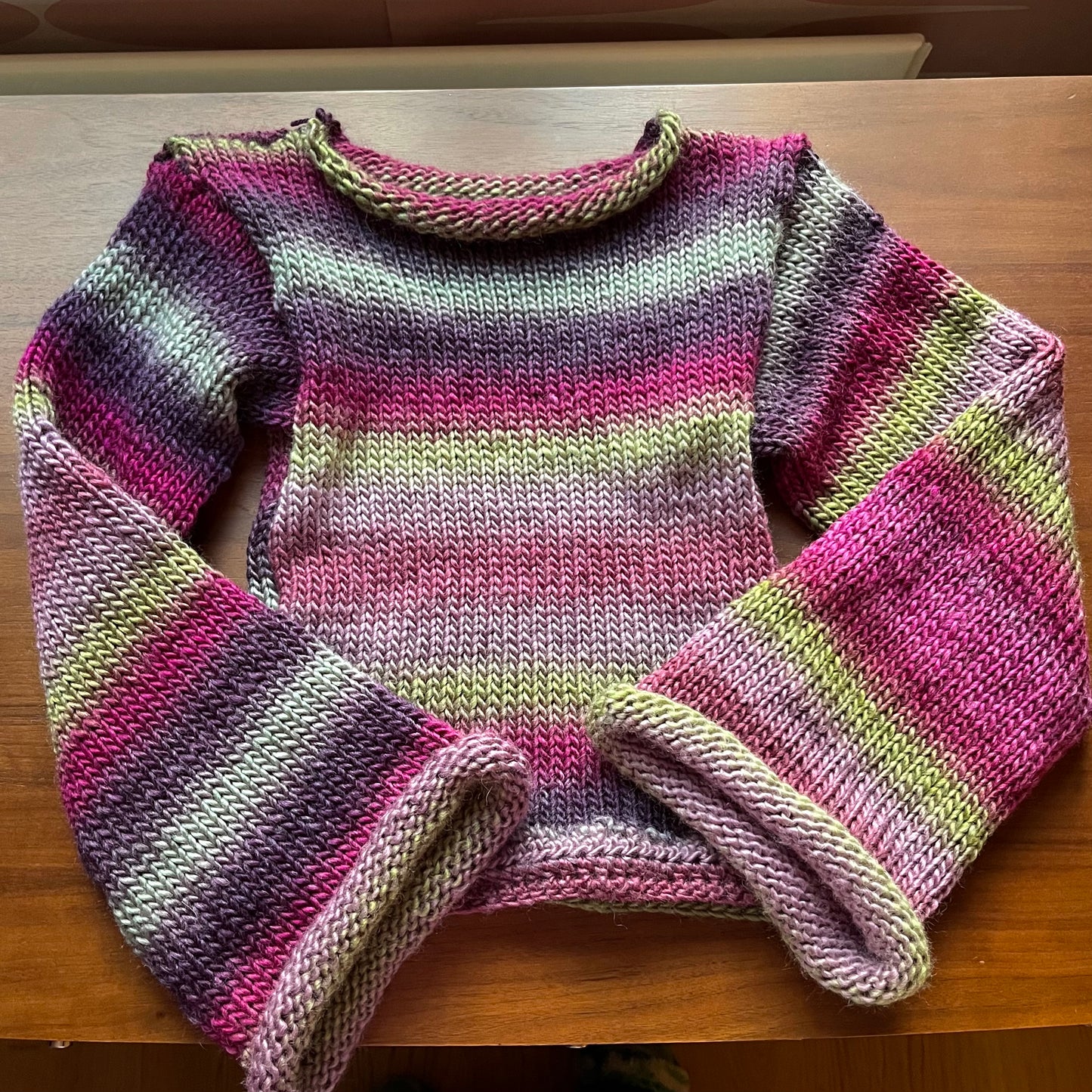 Handmade ombré knitted flared sleeve jumper in green and purple shades