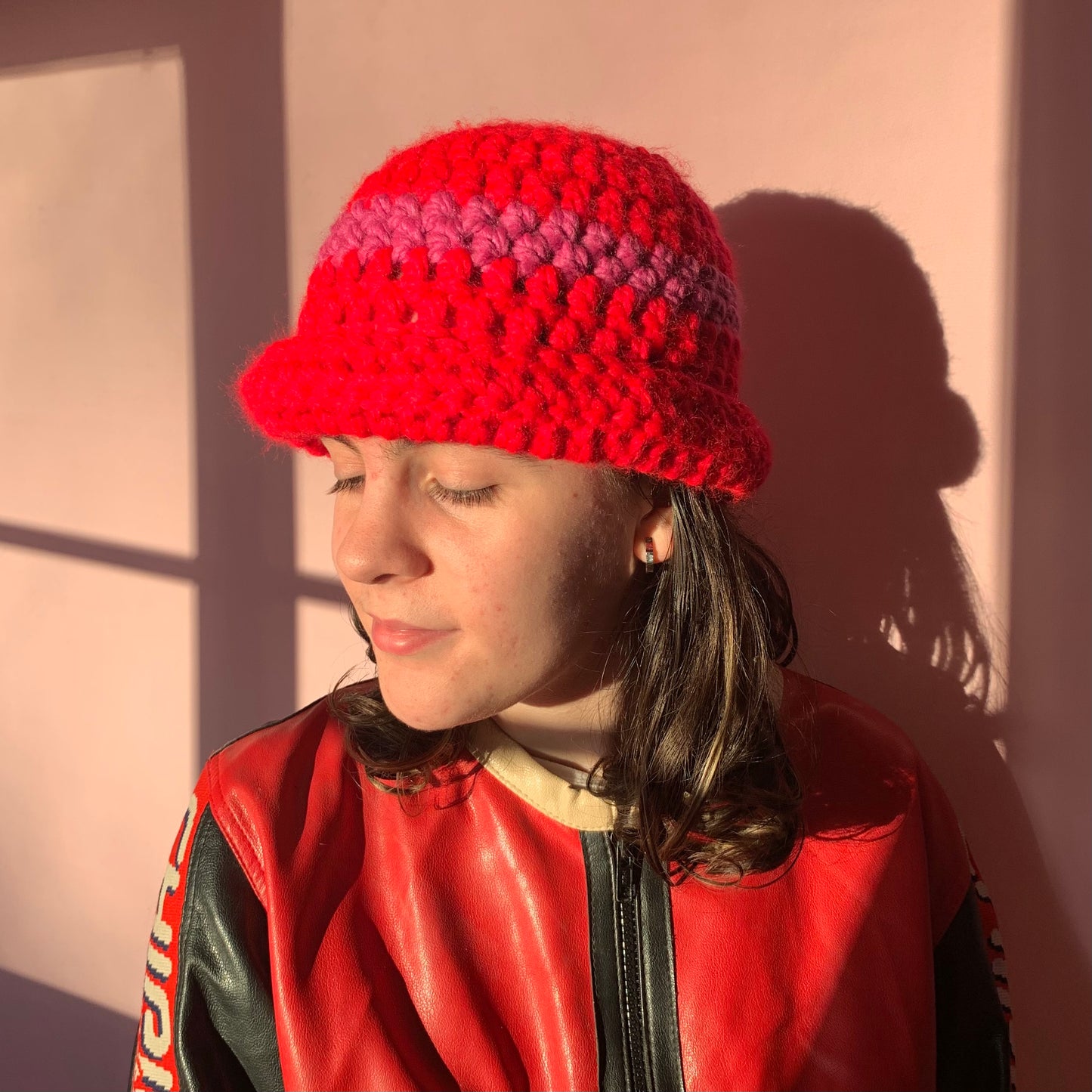 Handmade scarlet red chunky crochet bowler hat with fuschia pink stripe