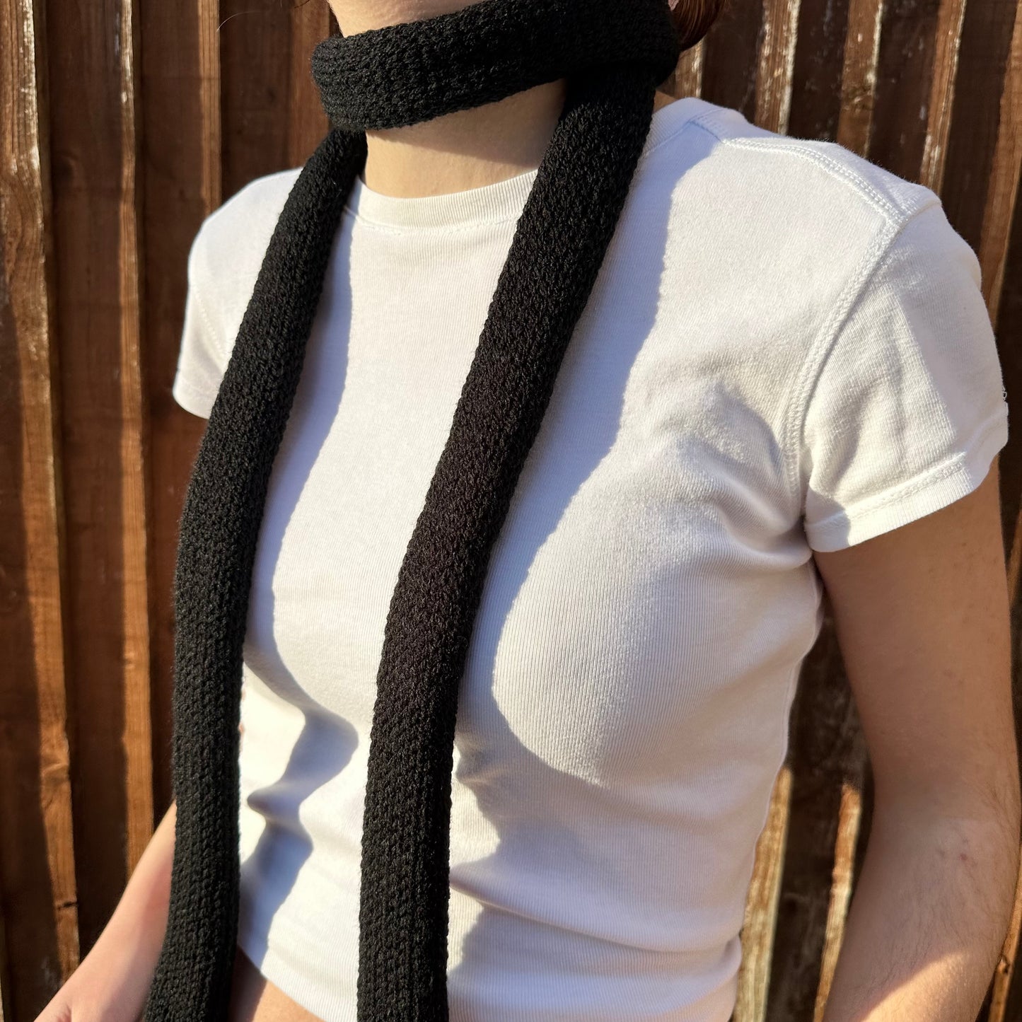Handmade knitted skinny scarf in black