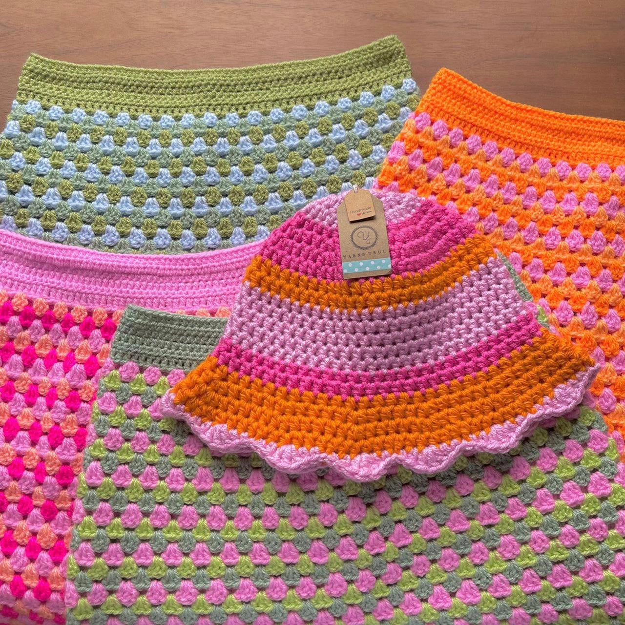 Handmade scallop edge crochet bucket hat in orange and pink