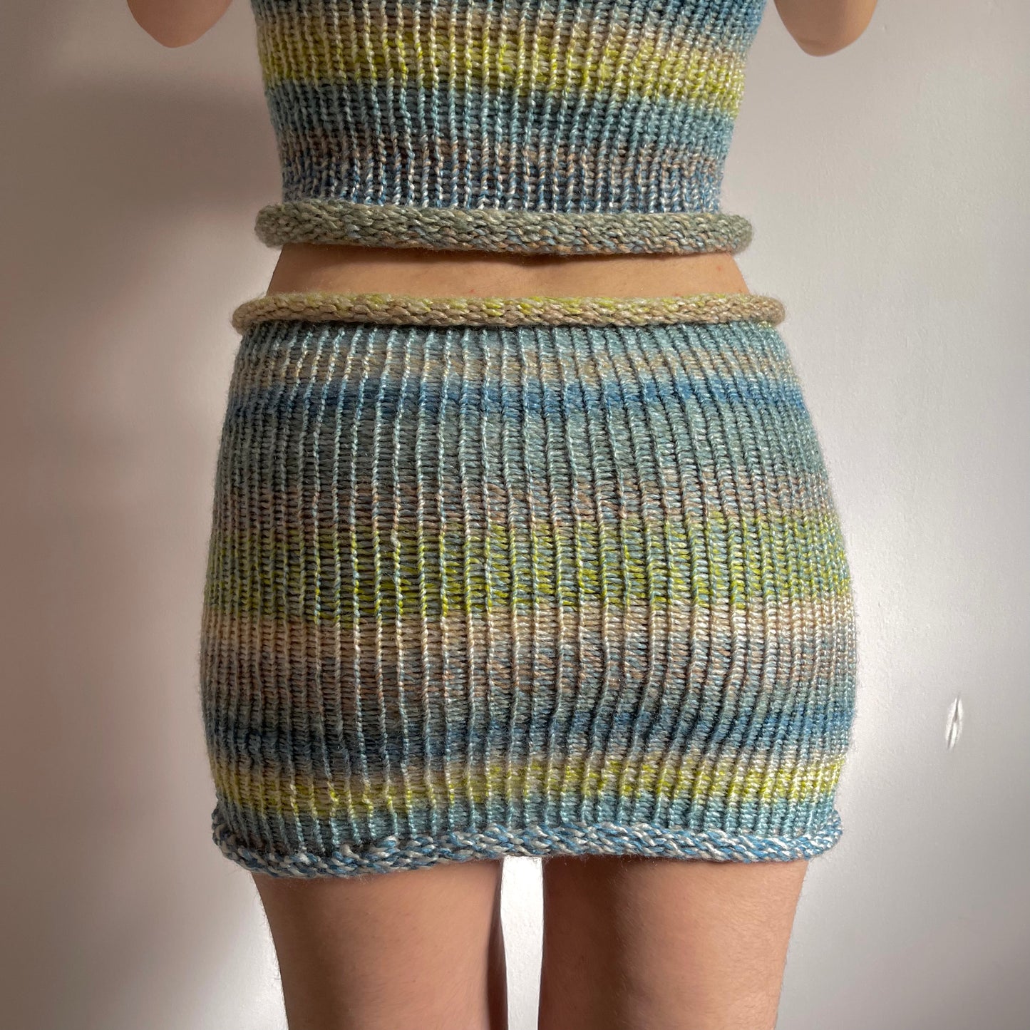 Handmade knitted mini skirt in green, beige, yellow and blue
