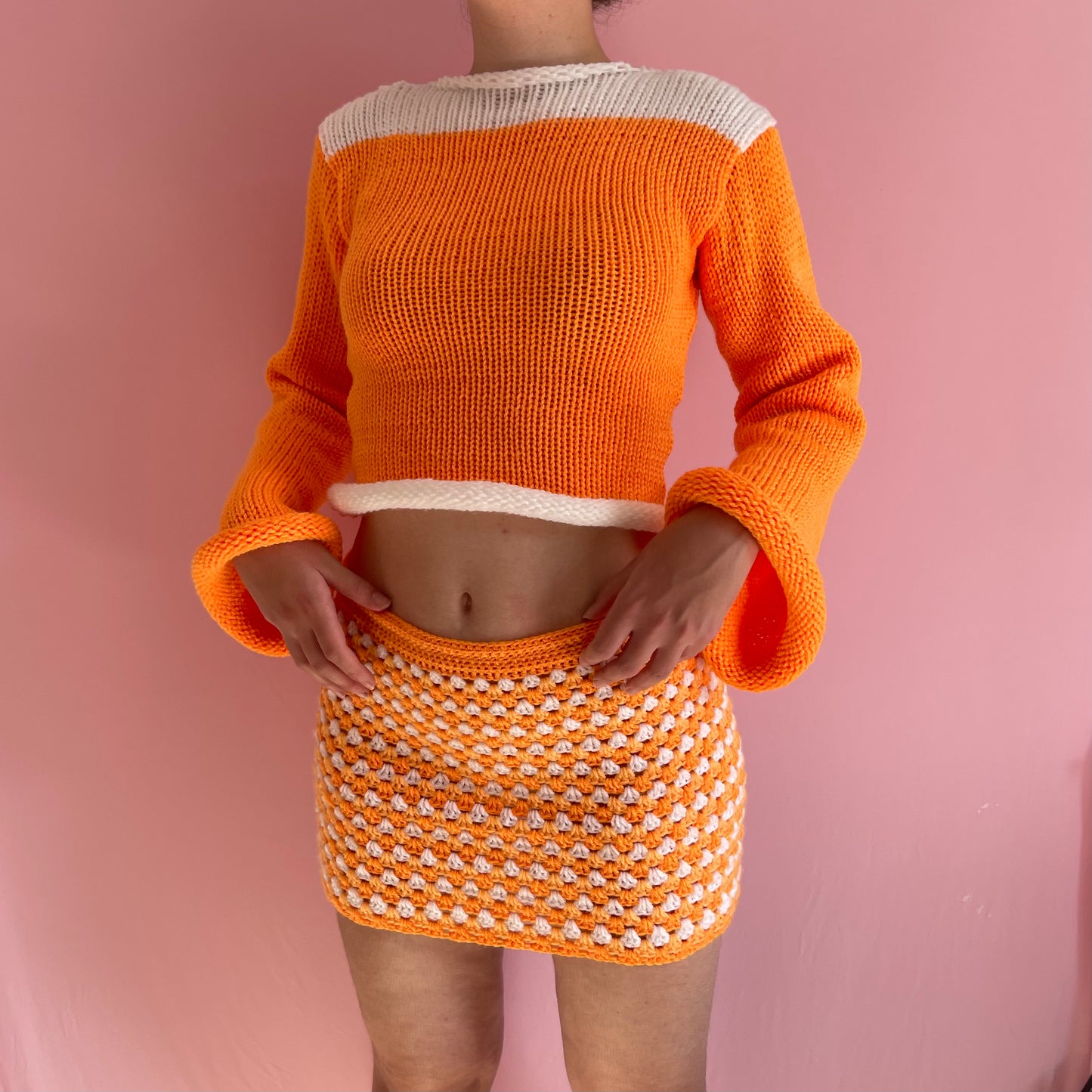 Handmade knitted colour block jumper in orange and white