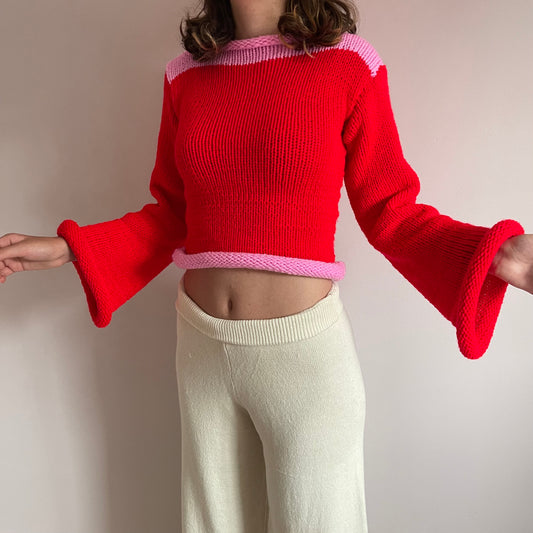 Handmade knitted colour block jumper in red and pink