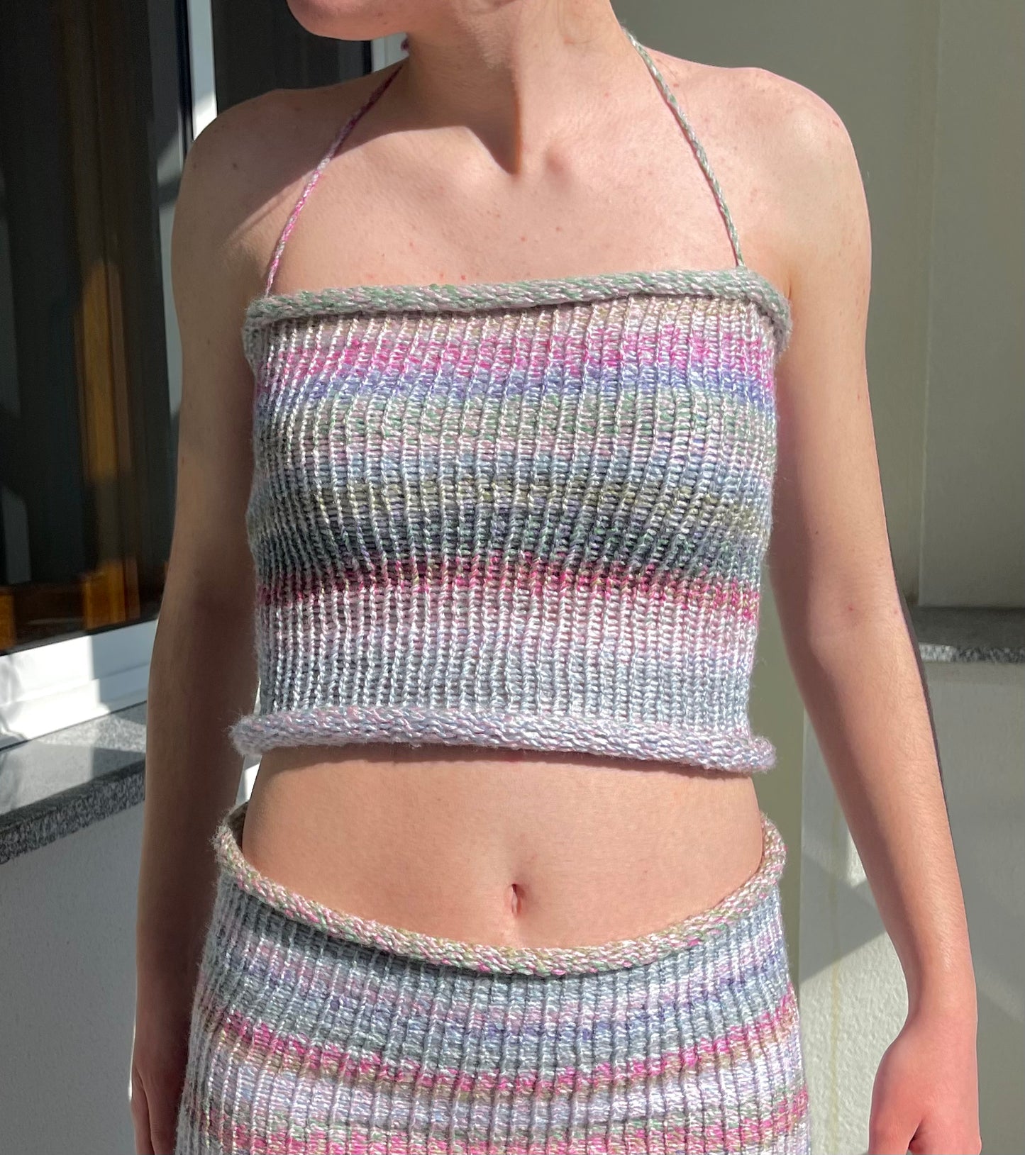 Handmade knitted criss-cross halter neck top in pastel shades